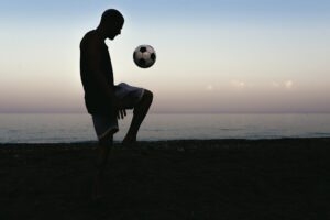 Man playing soccer.